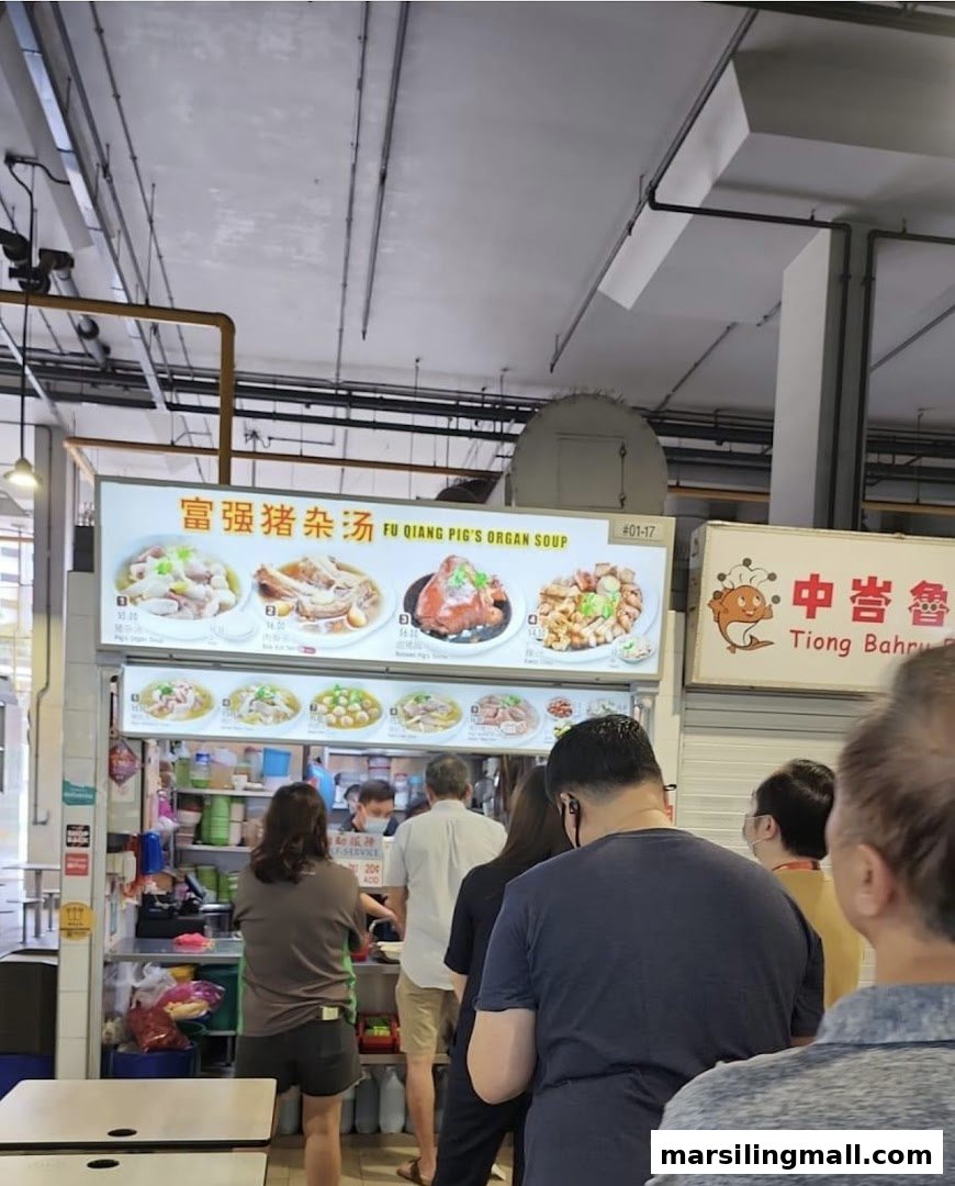 A bustling hawker stall, 'Fu Qiang Pig's Organ Soup', with a prominent menu board displaying various dishes.