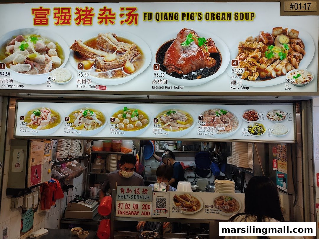 A vibrant menu board showcasing various pig organ soups and braised dishes at a bustling food stall.