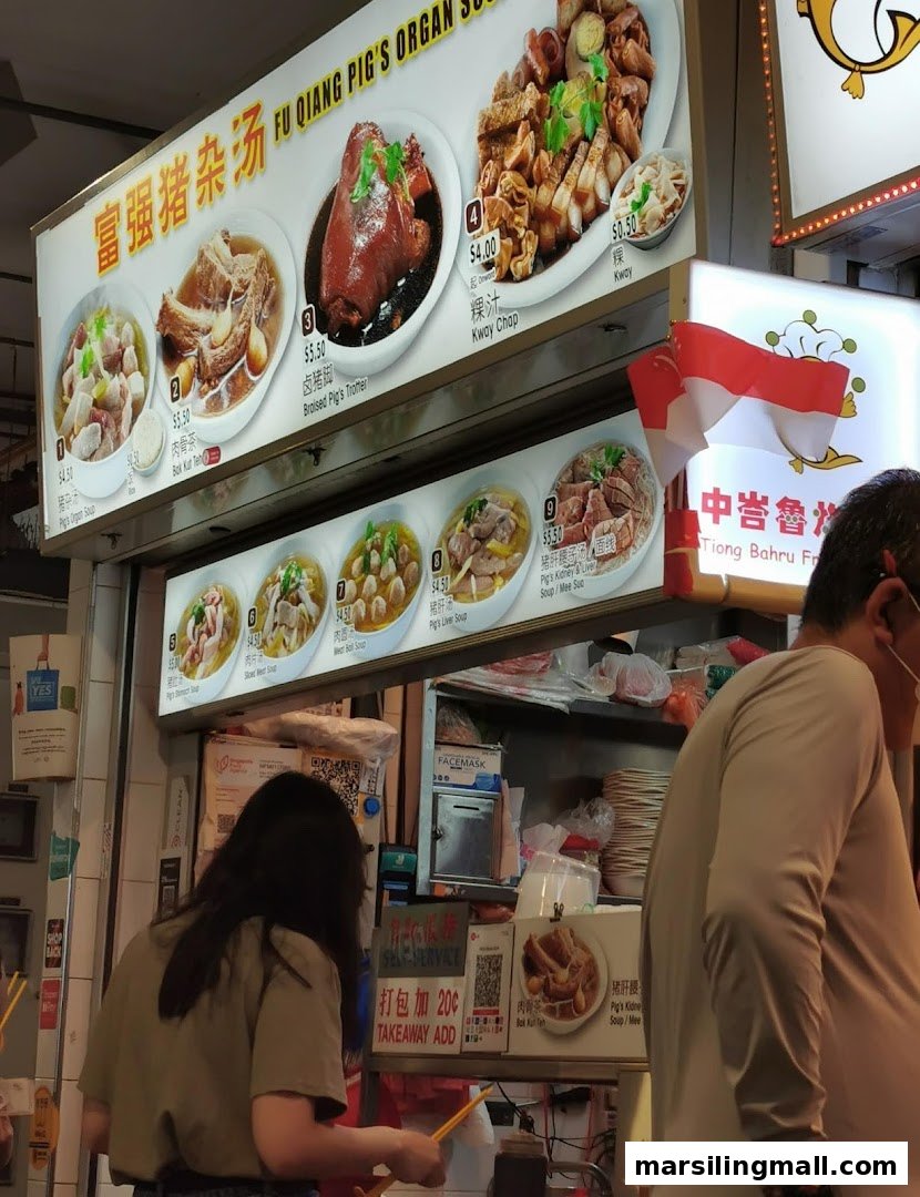 A food stall's menu board displaying various traditional Chinese pork dishes and soups with prices.