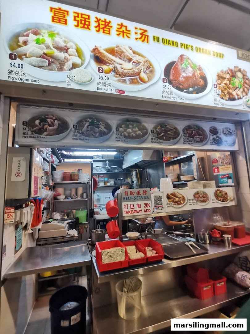 A bustling food stall counter showcasing a variety of traditional Chinese soups and dishes.