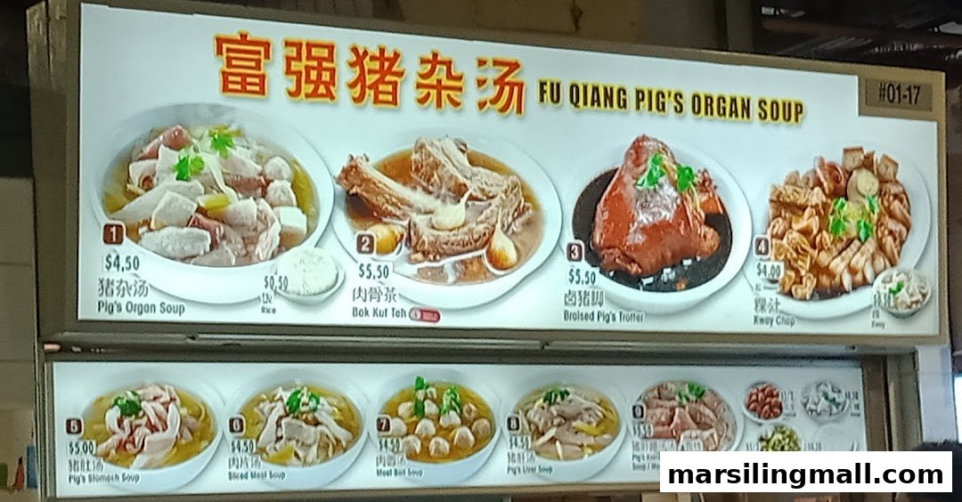A brightly lit menu board displaying various pork organ soups and other traditional Chinese dishes with prices.