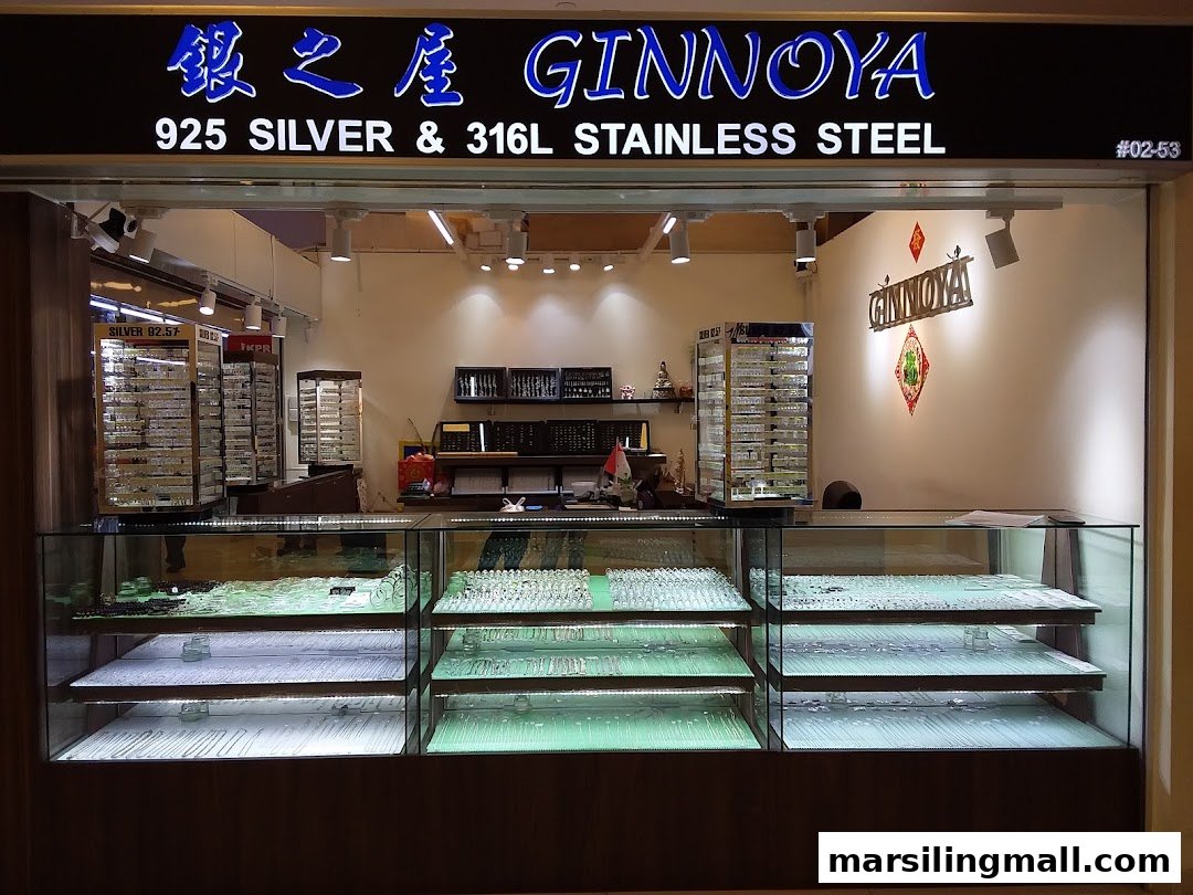 The shopfront of Ginnoya 925 Silver, showcasing display cases filled with silver and stainless steel jewelry.