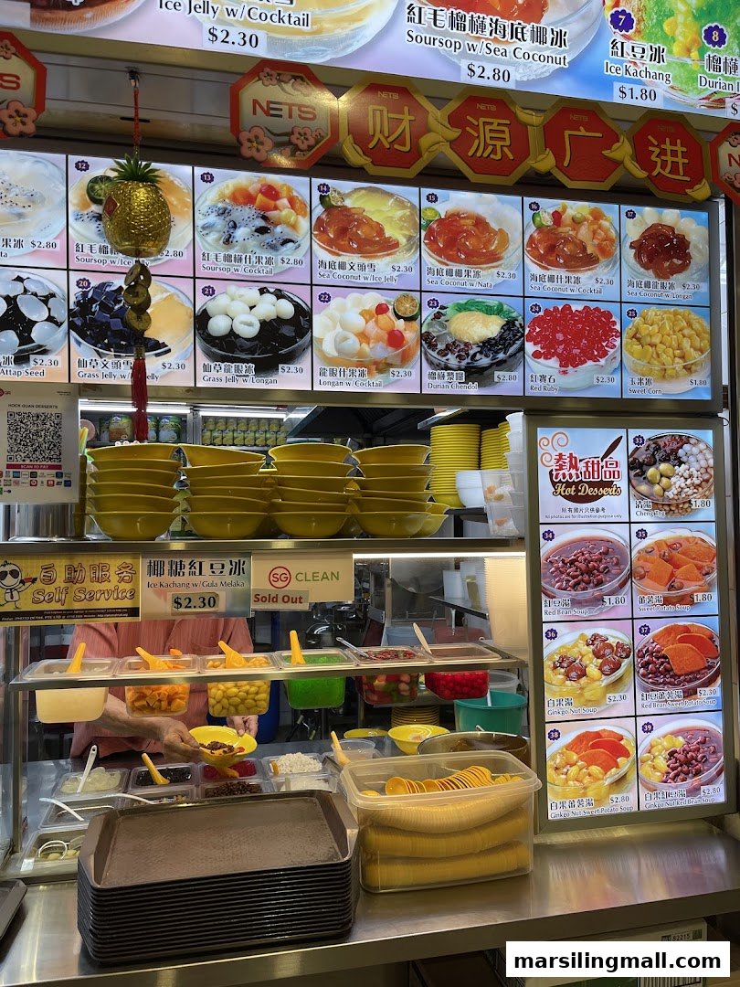 A vibrant dessert stall showcasing a wide menu of cold and hot traditional Asian desserts with prices.