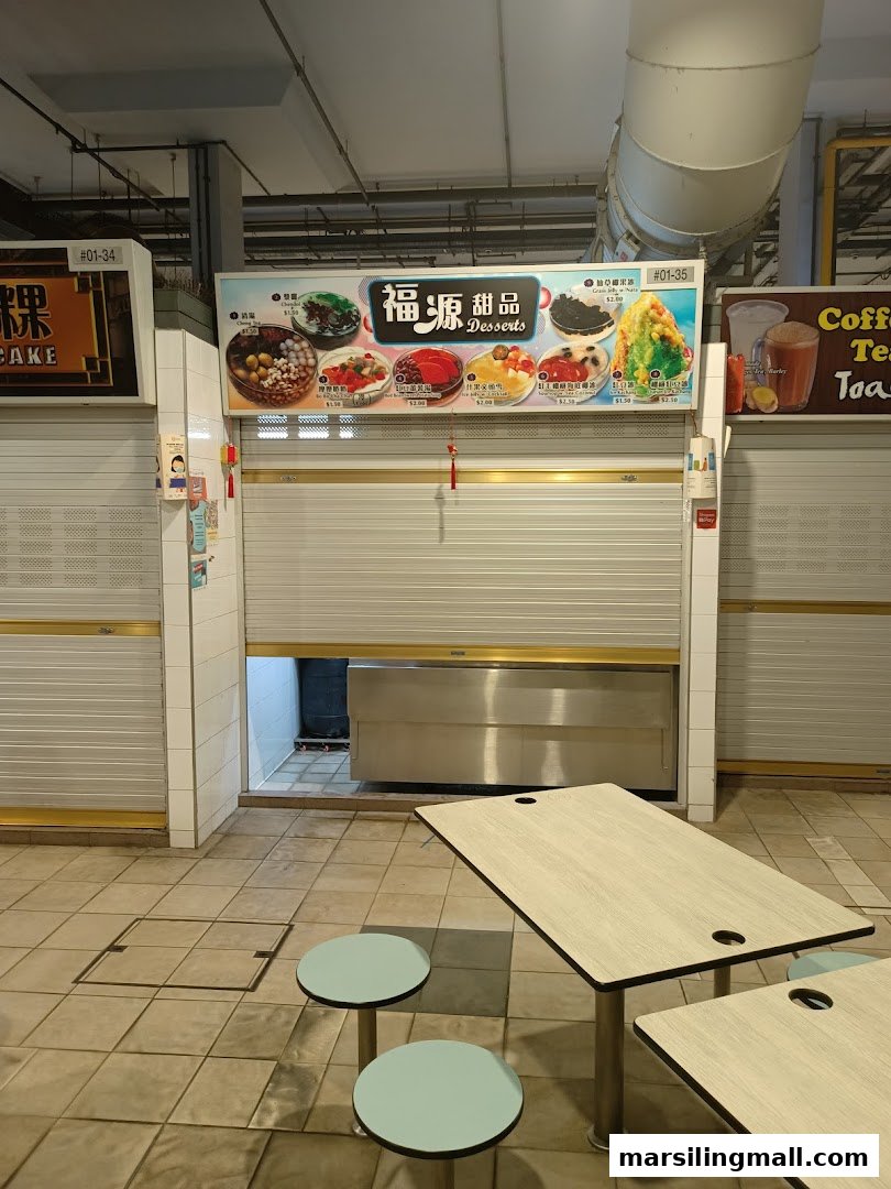 The closed front of Hock Guan Desserts, featuring a vibrant menu board with various traditional sweet treats.