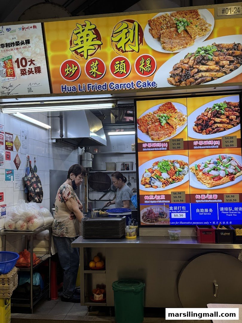 A bustling hawker stall featuring its menu board with fried carrot cake and omelette dishes.
