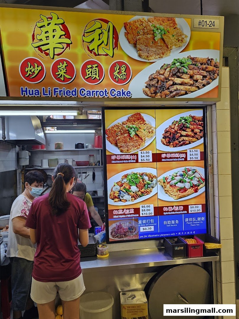 A bustling food stall, Hua Li Fried Carrot Cake, with a digital menu displaying various local dishes and prices.