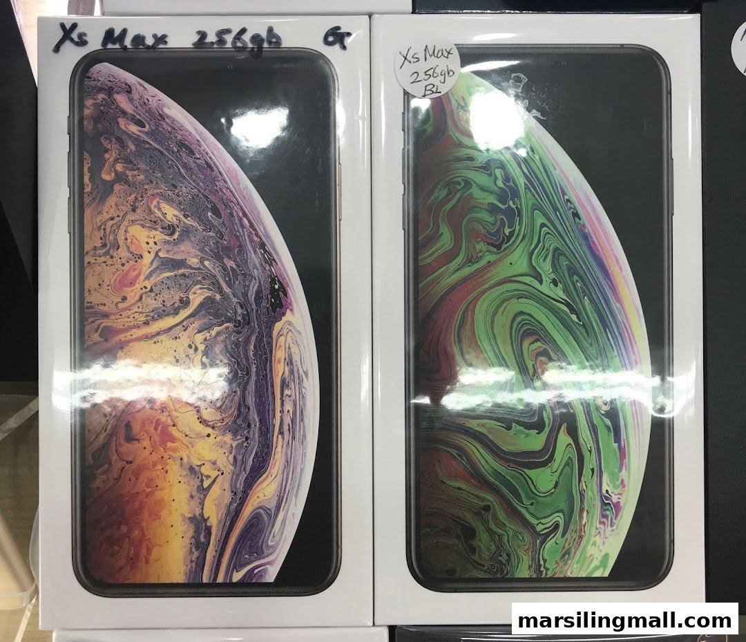 Two iPhone Xs Max boxes, one with purple/gold and one with green abstract imagery, are displayed.