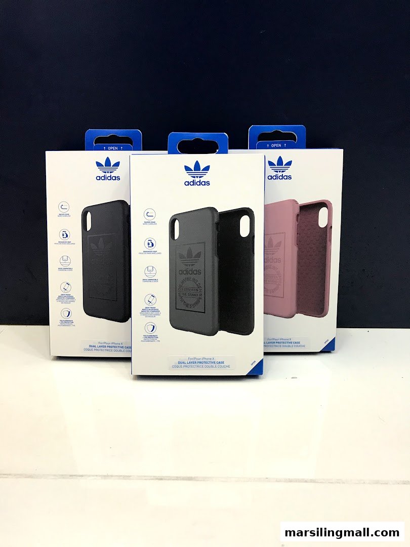 Three Adidas dual-layer protective cases for iPhone X in their original packaging.