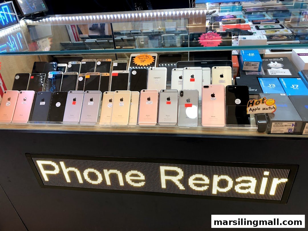 A display case showcasing numerous smartphones and a prominent 'Phone Repair' sign at ImobileHub.