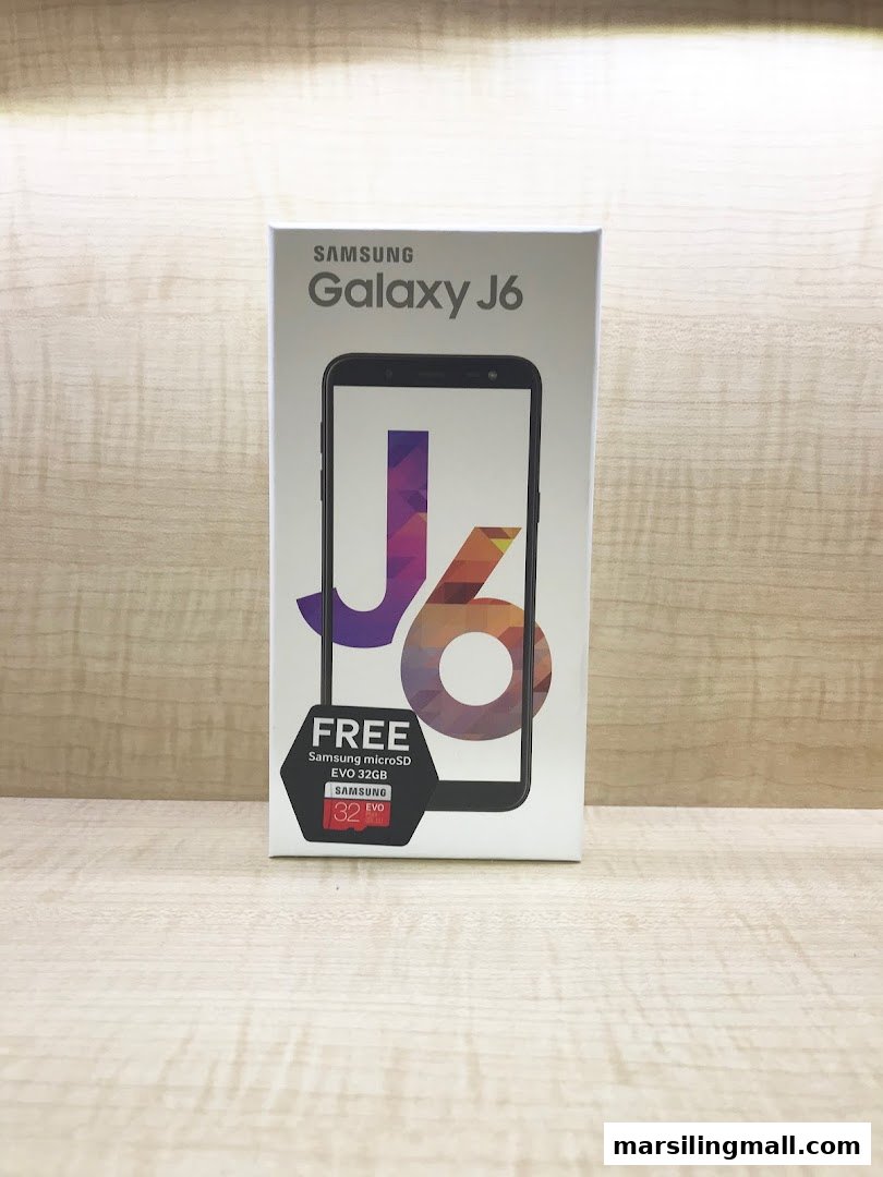 A Samsung Galaxy J6 smartphone box, featuring a free 32GB Samsung microSD EVO offer.