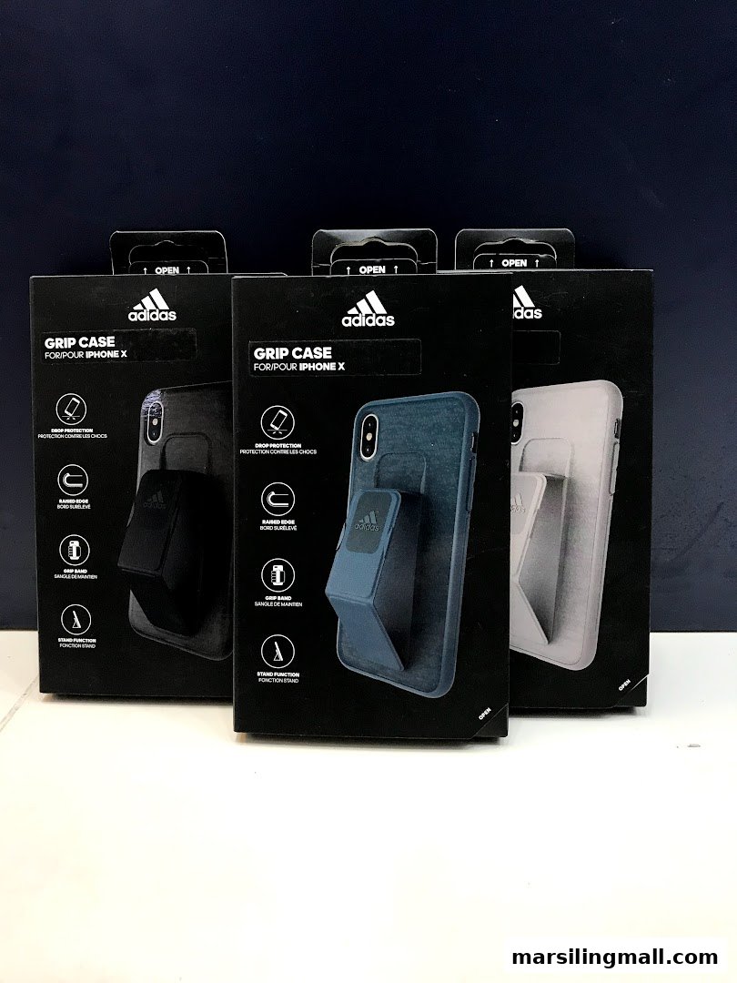 Three Adidas Grip Cases for iPhone X in their packaging, showcasing design and features.
