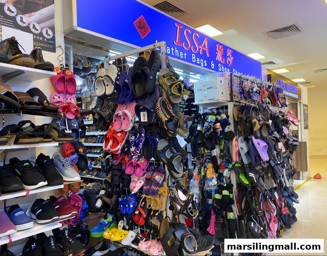 An interior view of Issa Leather Bags & Shoes Shop, showcasing a wide variety of footwear and accessories.
