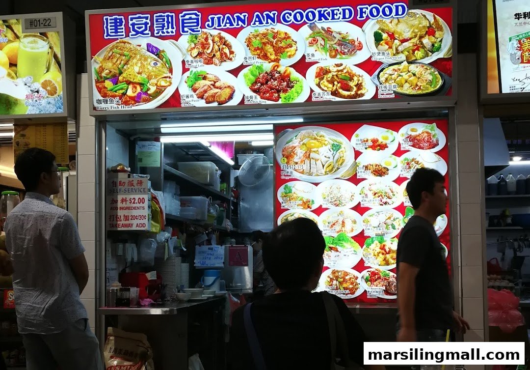 A bustling food stall, Jian An Cooked Food, showcasing its extensive menu of local dishes.