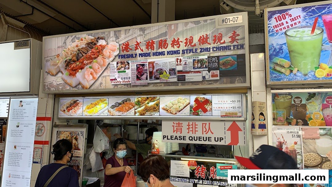 A bustling hawker stall specializing in freshly made Hong Kong style Zhu Chang Fen with customers queuing.
