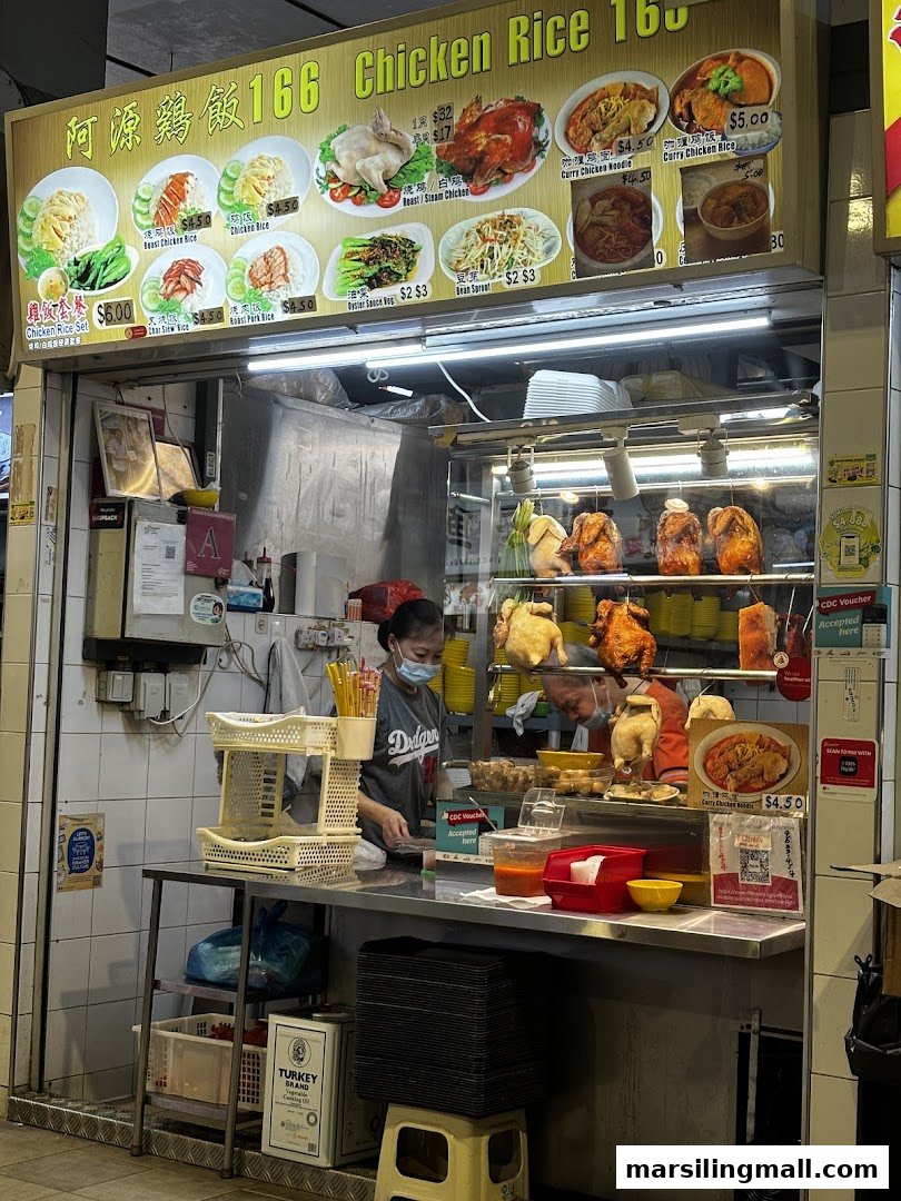 A bustling hawker stall named 'Chicken Rice 166' with a menu board and staff preparing food.