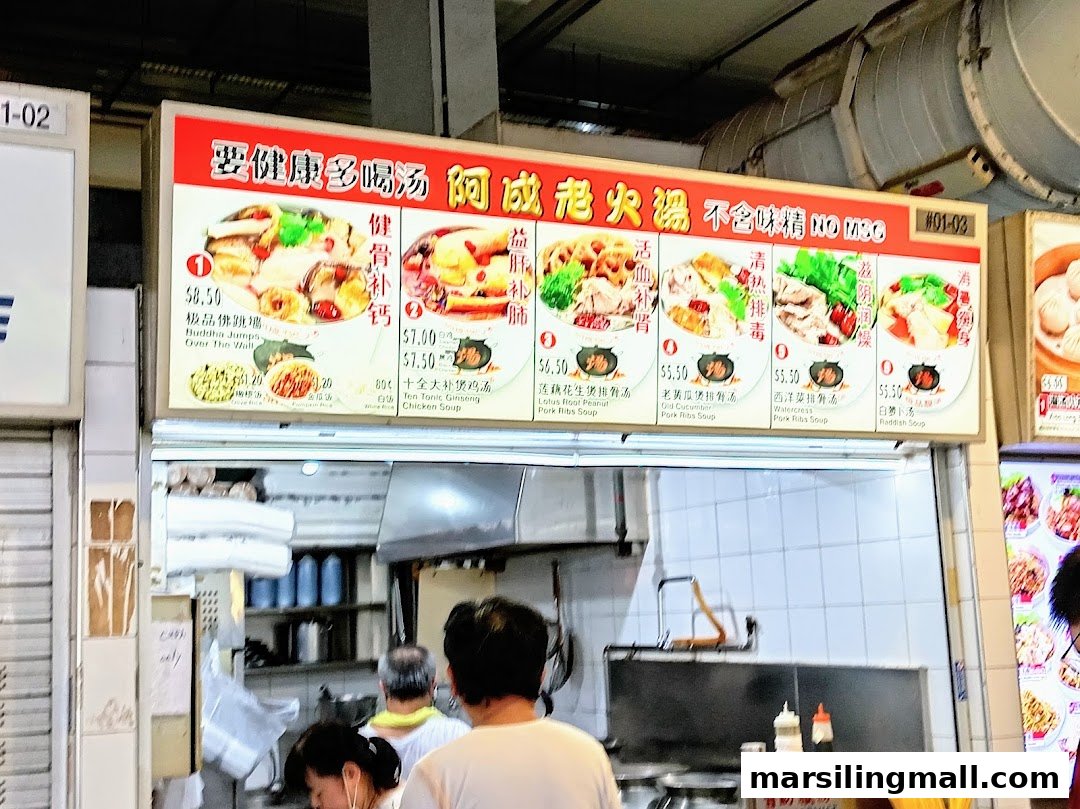 A hawker stall's menu board displaying various traditional Chinese soup dishes with prices.