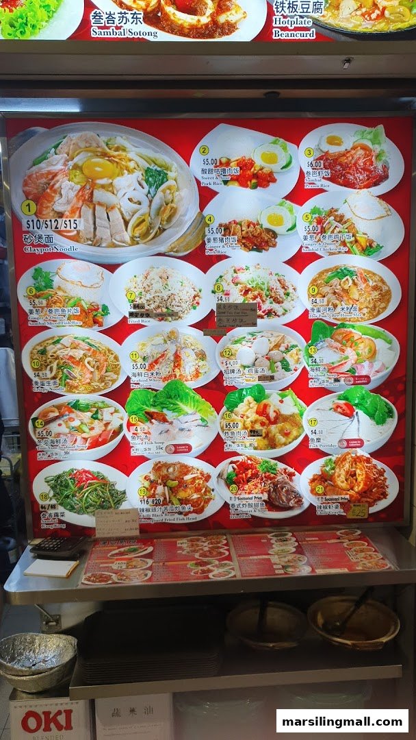 A brightly lit menu board showcasing various Asian dishes with prices at a hawker stall.