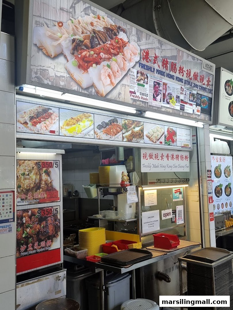 A bustling hawker stall counter showcasing various freshly made Hong Kong-style dishes.