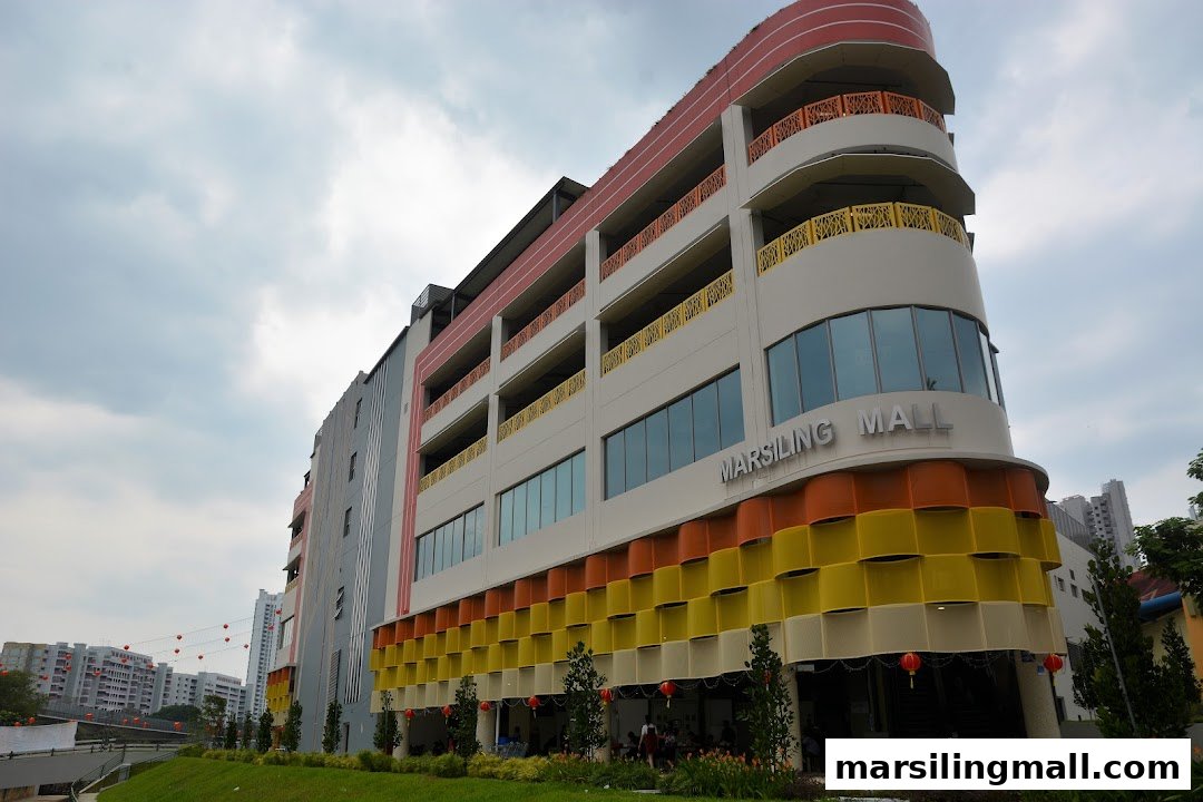 The vibrant exterior of Marsiling Mall under a cloudy sky.