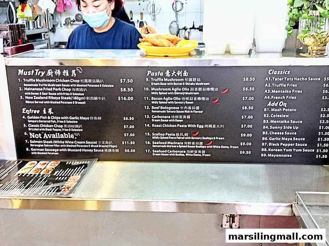 A detailed menu board displaying a variety of Western and pasta dishes at a hawker centre stall.