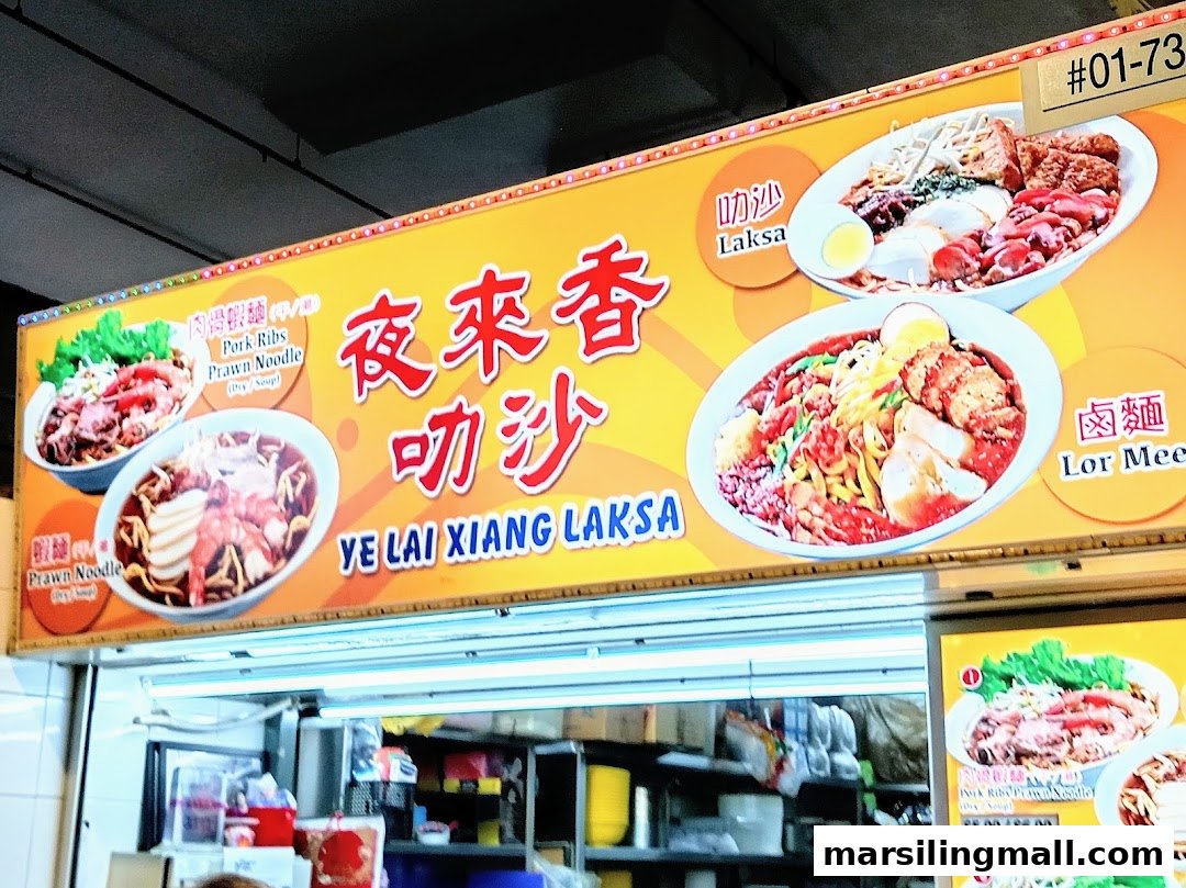 A vibrant hawker stall signboard featuring popular Singaporean dishes like Laksa, Lor Mee, and Prawn Noodles.