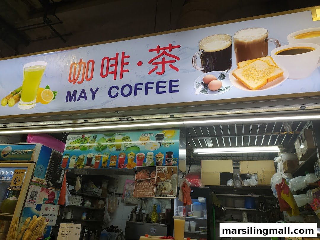 A vibrant hawker stall named May Coffee, offering traditional beverages and breakfast items.
