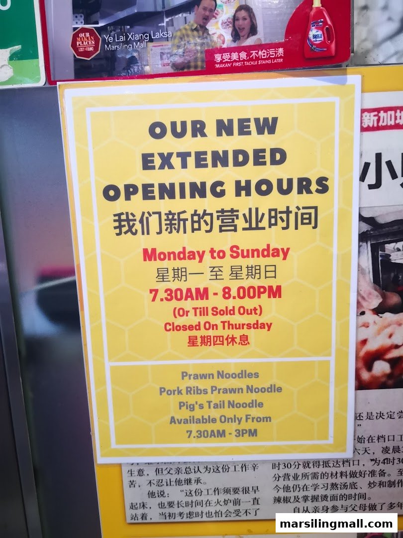 A sign detailing extended opening hours and specific noodle dishes available at a hawker stall.