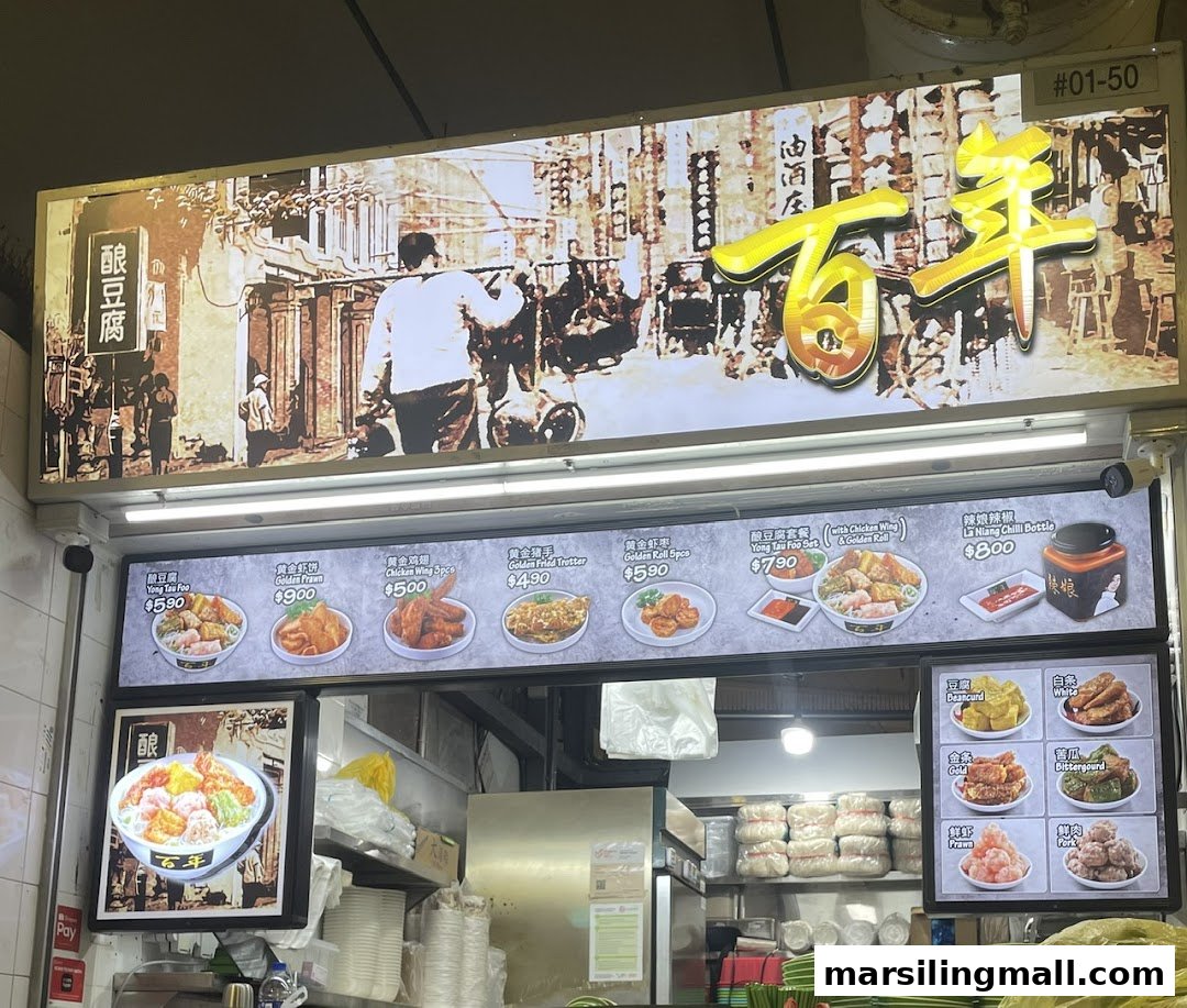 A hawker stall's menu board displaying various Yong Tau Foo dishes and prices.