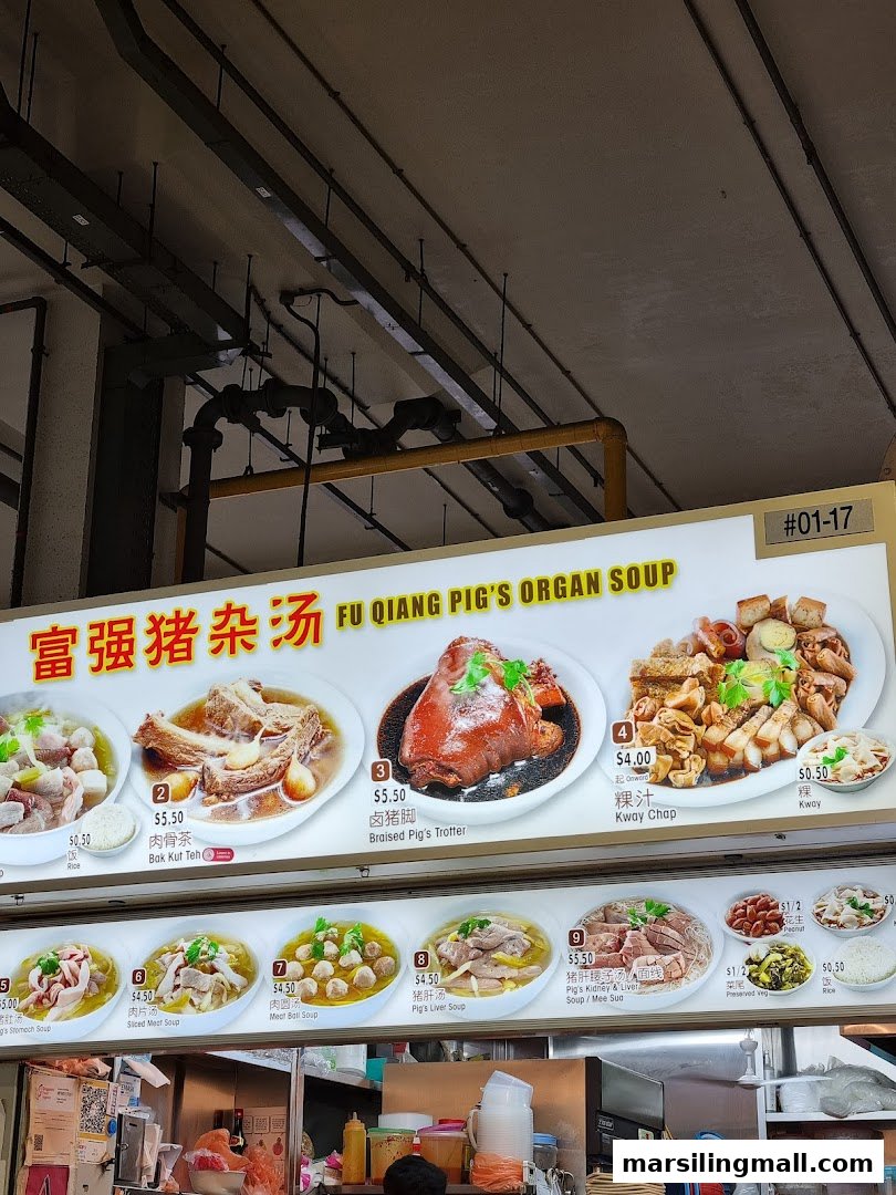 A menu board displaying various pig's organ soup dishes and sides with prices.
