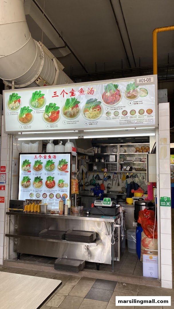A hawker stall named '三个宝鱼汤' (Three Treasures Fish Soup) with menu boards and kitchen visible.