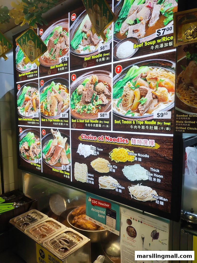 A brightly lit menu board showcasing various beef noodle dishes and noodle choices.