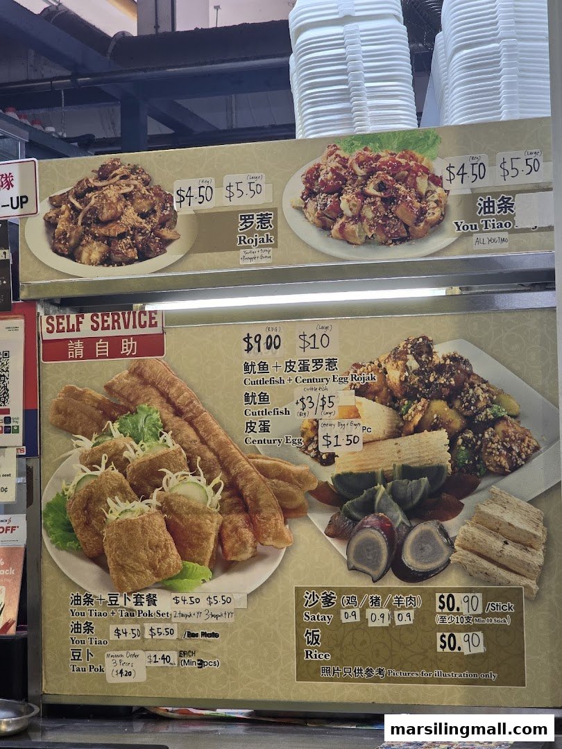 A vibrant menu board showcasing various Rojak dishes, You Tiao, Satay, and other local delights with prices.