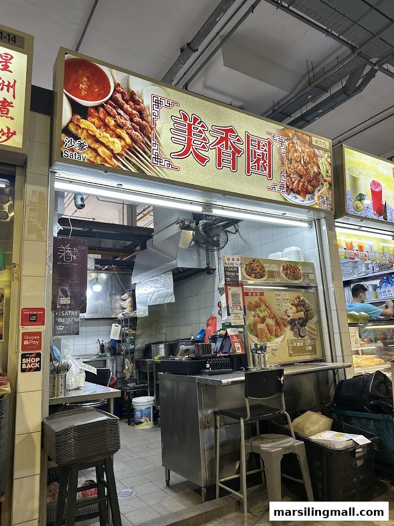 The storefront of Mei Xiang Yuan Satay Rojak, featuring its signboard and counter area.
