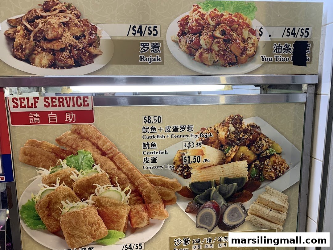 A vibrant menu board displaying various Rojak dishes, add-ons, and Satay with prices and self-service instructions.