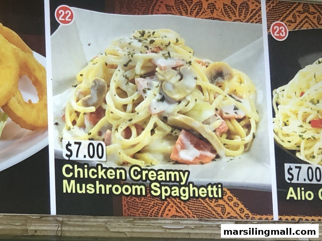 A close-up of a menu board displaying pasta dishes with prices and images.