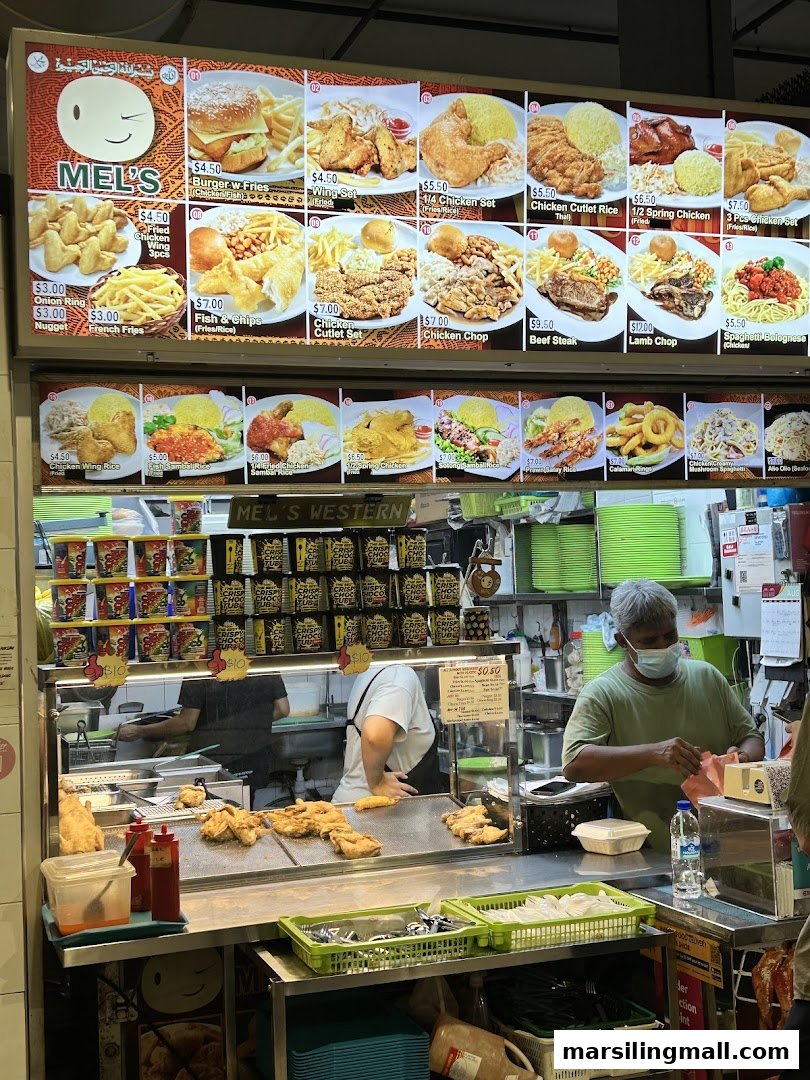 A bustling food stall, Mel's Western, showcasing its extensive menu board and kitchen operations.