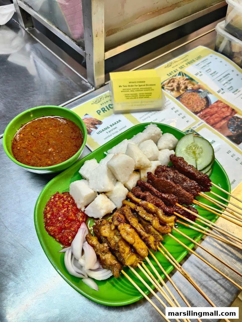 A vibrant plate of grilled satay skewers with rice cakes, peanut sauce, and chili paste.