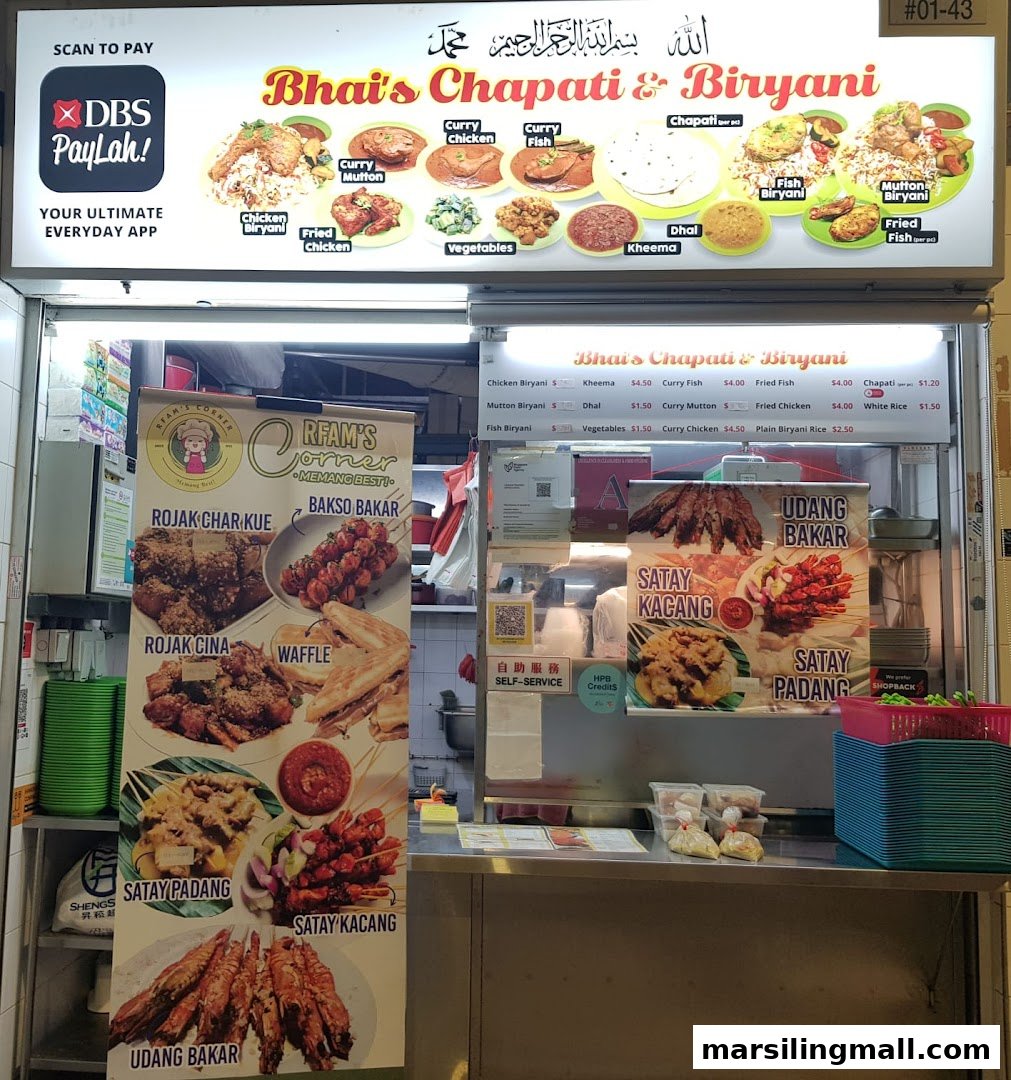 A vibrant food stall showcasing a diverse menu of Indian and local delights, including satay and biryani.