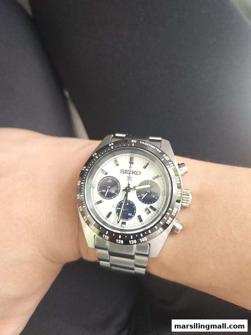 A close-up view of a stylish Seiko chronograph watch worn on a wrist.
