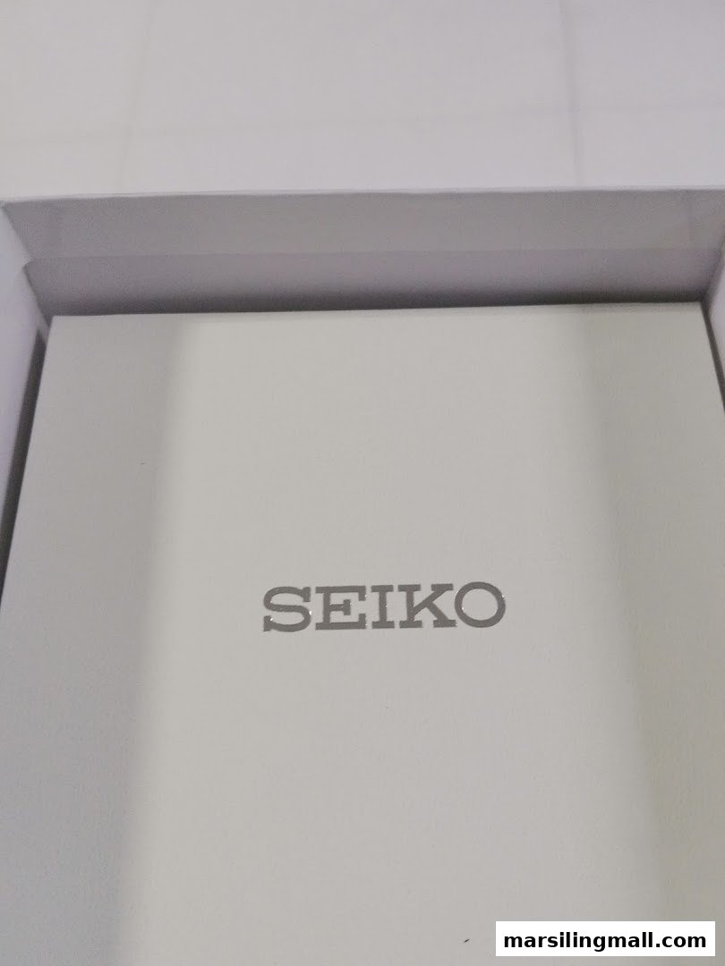 Close-up of a white Seiko watch box, featuring the brand logo.