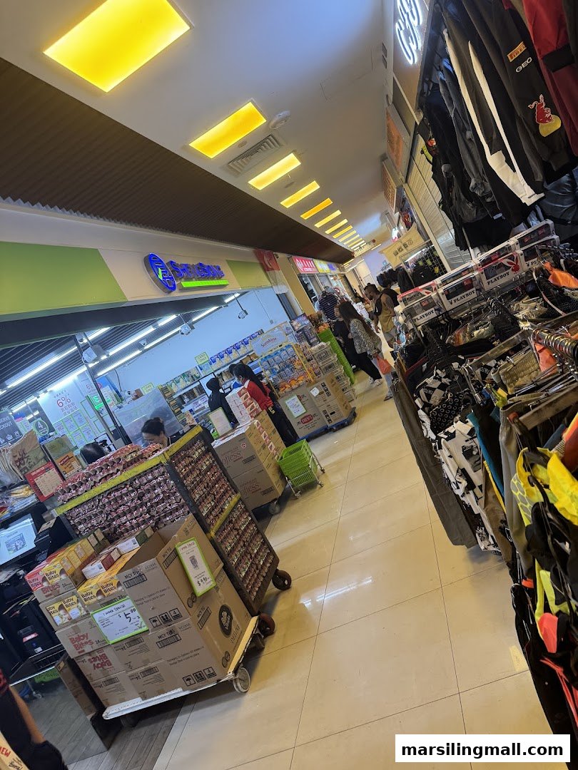 Interior view of Sheng Siong Supermarket with customers, products, and shopping carts.