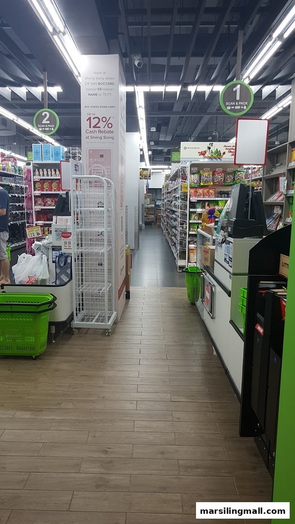 Interior view of Sheng Siong Supermarket showing aisles, checkout counters, and promotional signage.