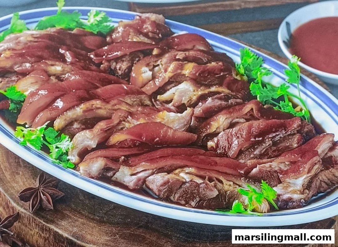 A platter of succulent braised pig trotters garnished with fresh cilantro, ready to be served.