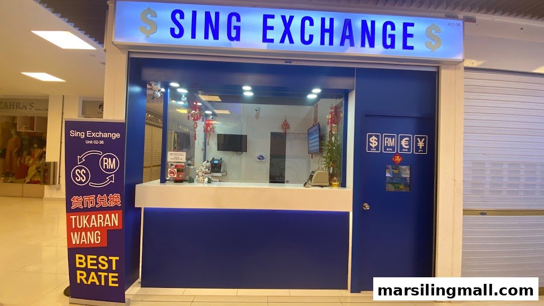 The image displays the bright blue and white storefront of Sing Exchange Money Changer, offering currency exchange services.