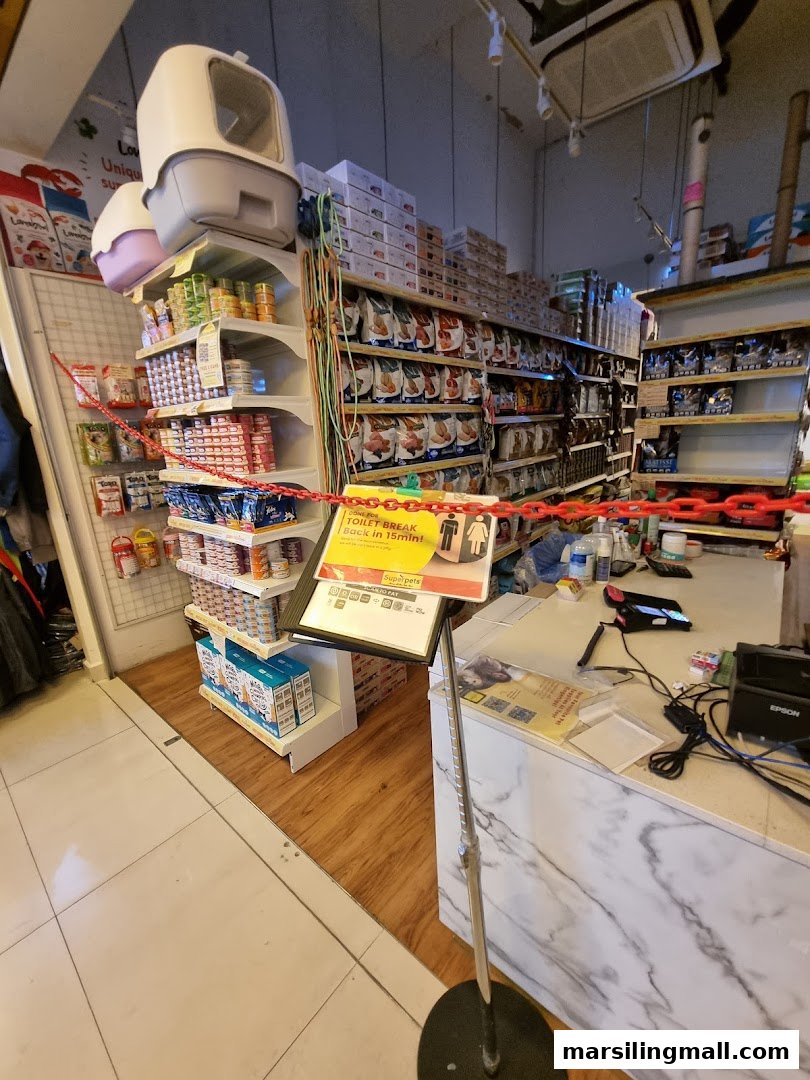 Interior view of Superpets Marsiling Mall, showcasing shelves stocked with pet food and supplies.