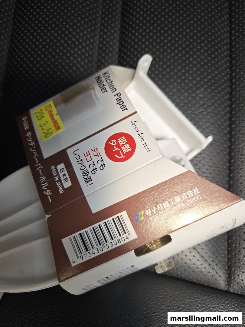 Close-up of a packaged kitchen paper holder with a price tag from ValueHub Department Store.