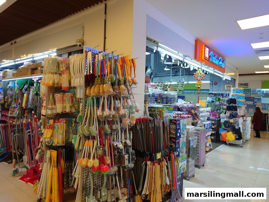 Interior view of ValueHub Department Store, showcasing a wide array of household cleaning supplies and general merchandise.