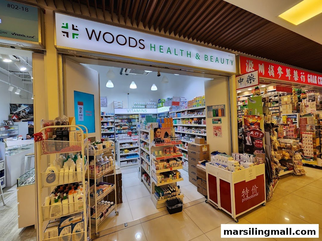 The entrance of Woods Health & Beauty pharmacy, showcasing health products and vitamins.