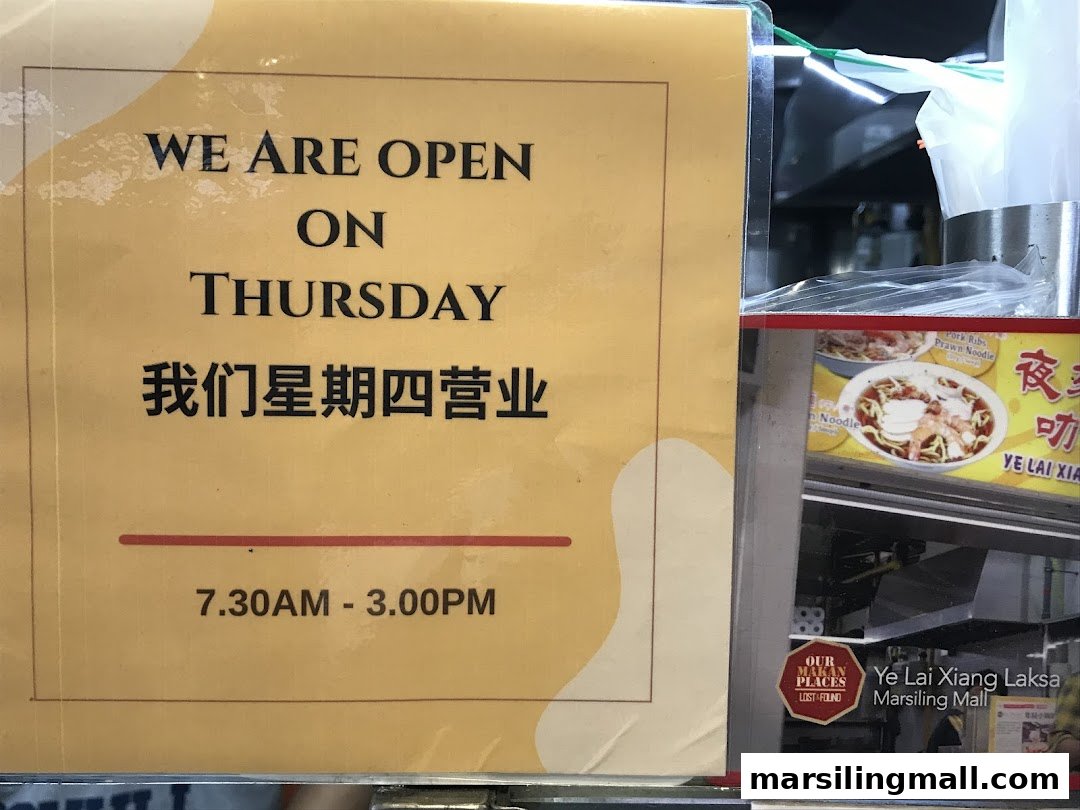 A sign for Ye Lai Xiang Laksa displaying Thursday opening hours from 7:30 AM to 3:00 PM.