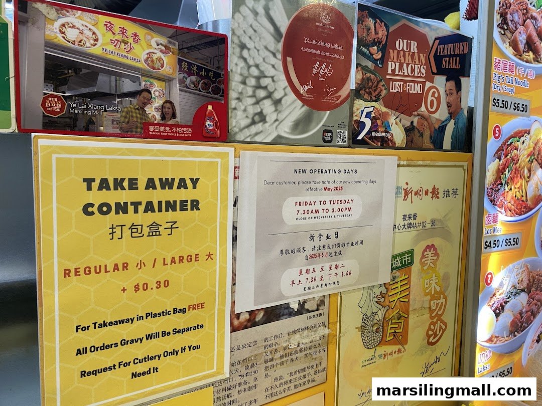 A vibrant display of signs for Ye Lai Xiang Laksa, featuring operating hours, takeaway info, and media features.